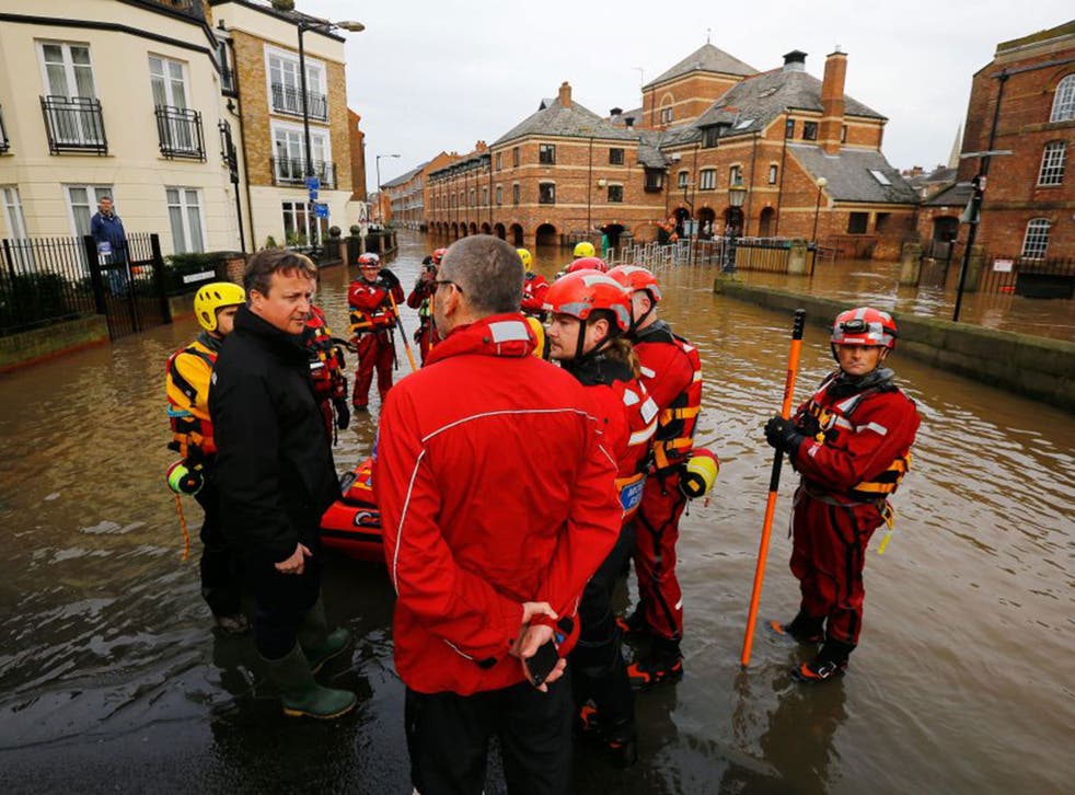 Ripple effect: David Cameron in flood-stricken York as pressure mounted on the Government over its lack of readiness to deal with the crisis