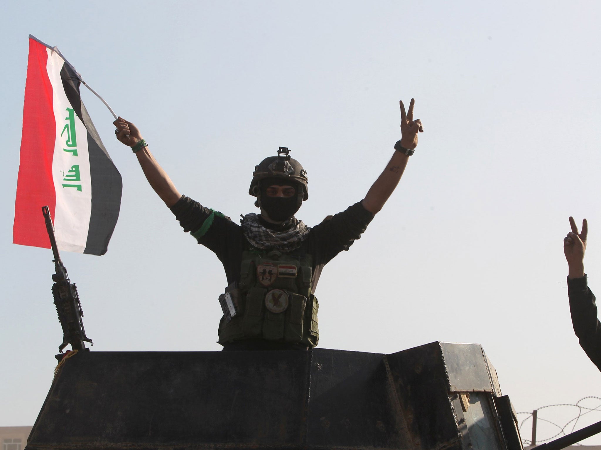 Government forces celebrate after recapturing the city of Ramadi