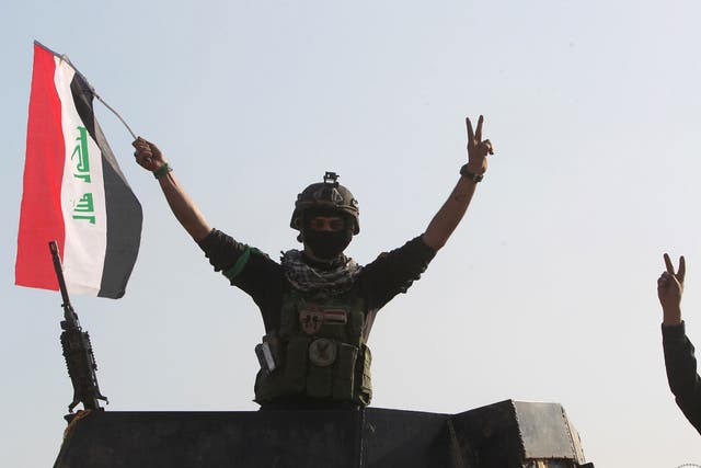 Government forces celebrate after recapturing the city of Ramadi