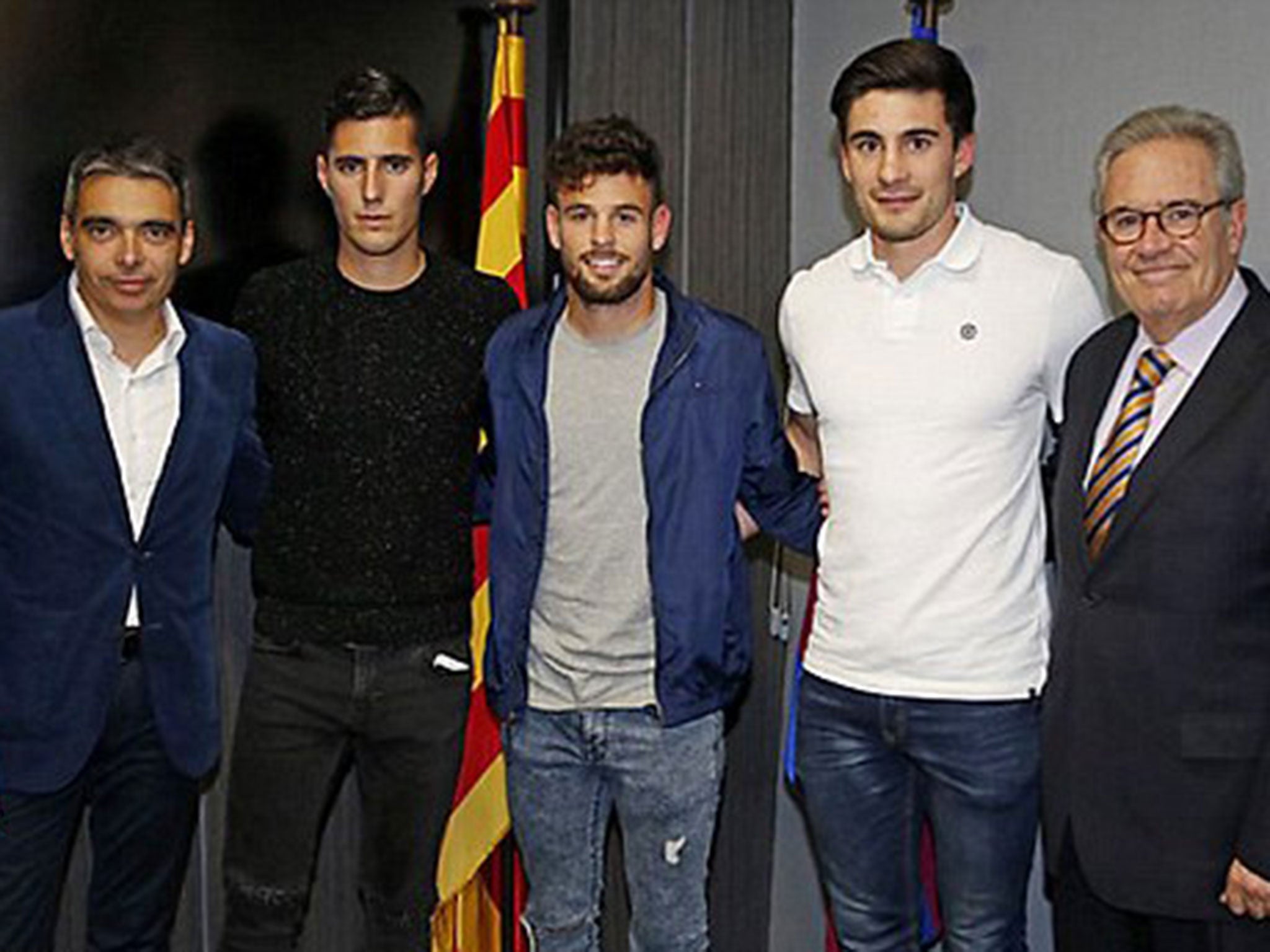 Sergi Guardiola (centre) is unveiled as a Barcelona player