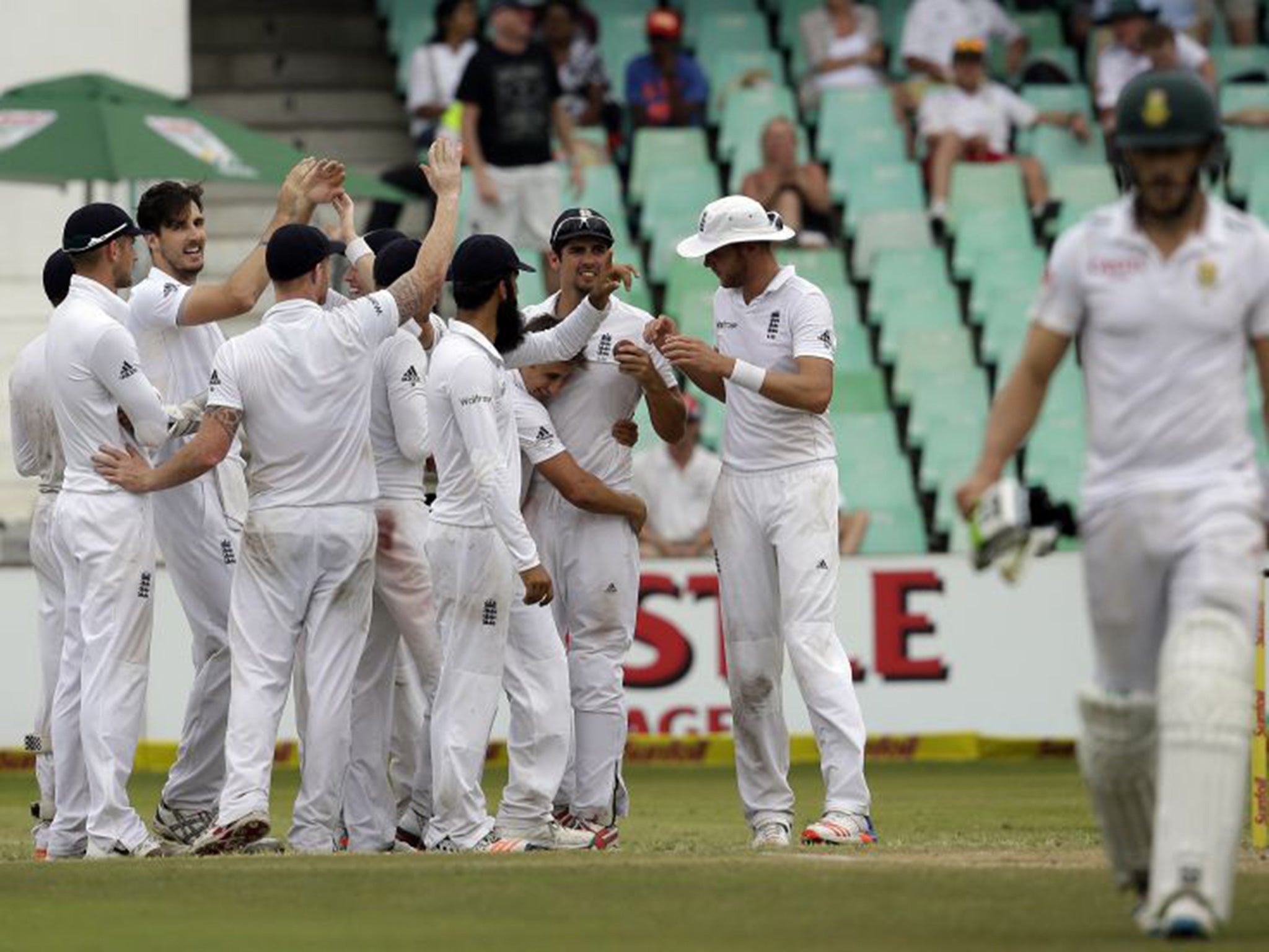 Steve Finn (second from left) celebrates after having South Africa batsman Faf du Plessis caught in the slips at the end of the day’s play