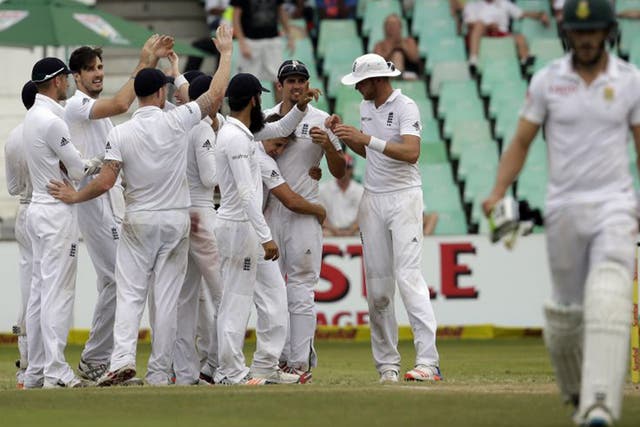 Steve Finn (second from left) celebrates after having South Africa batsman Faf du Plessis caught in the slips at the end of the day’s play