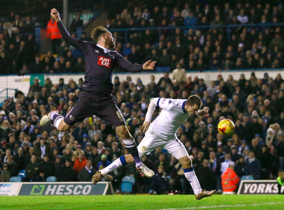 Chris Wood scores Leeds United’s second goal in front of the Sky TV cameras at Elland Road as the home side shared a thrilling contest with promotion-chasing Derby County