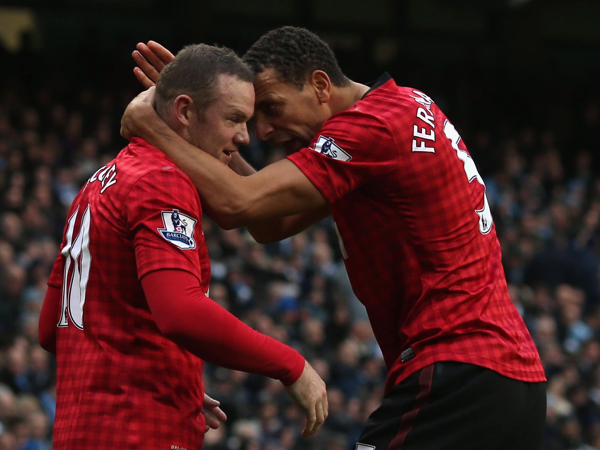 &#13;
Rooney and Rio Ferdinand celebrate a goal at Manchester City in December 2012&#13;