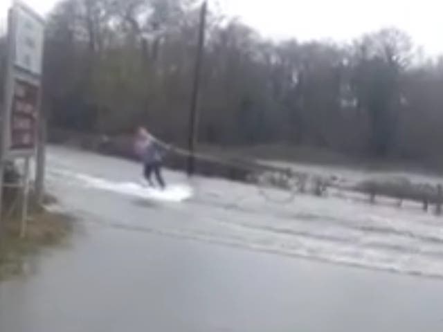 Video shows woman wakeboarding during floods in Ireland