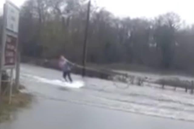 Video shows woman wakeboarding during floods in Ireland