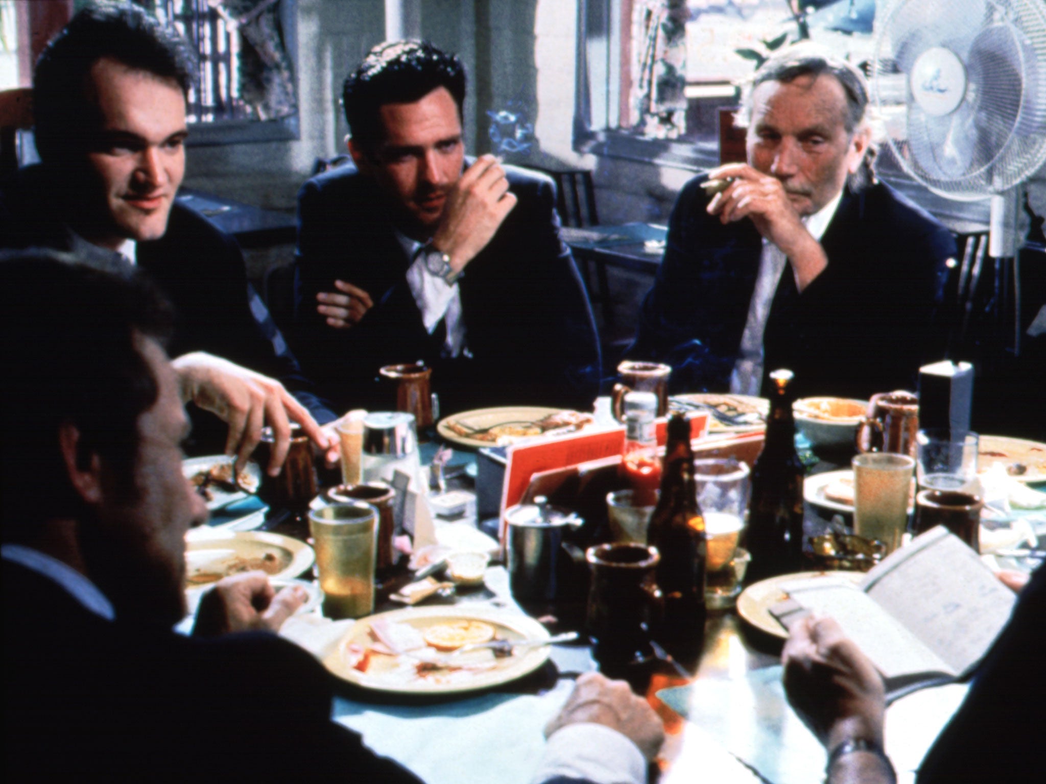 Dog days: Quentin Tarantino (left) with Michael Madsen next to him in a scene from Reservoir Dogs