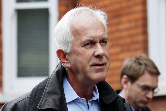 Environment Agency chairman Sir Philip Dilley leaves his flat in Marylebone, London, after arriving back in the country following a sunshine holiday in the Caribbean