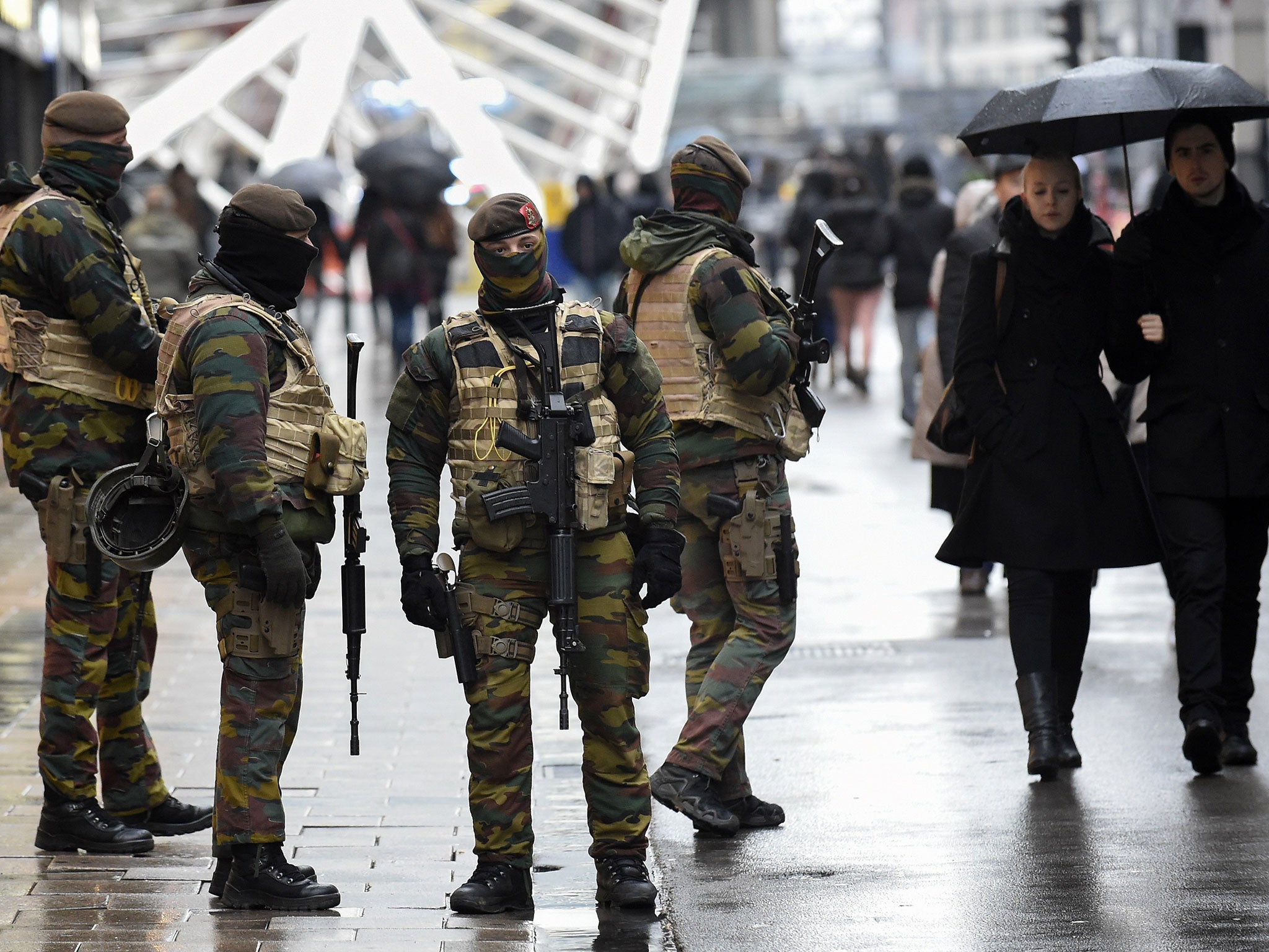 Soldiers patrol the Rue Neuve pedestrian shopping street in Brussels on 21 November, 2015