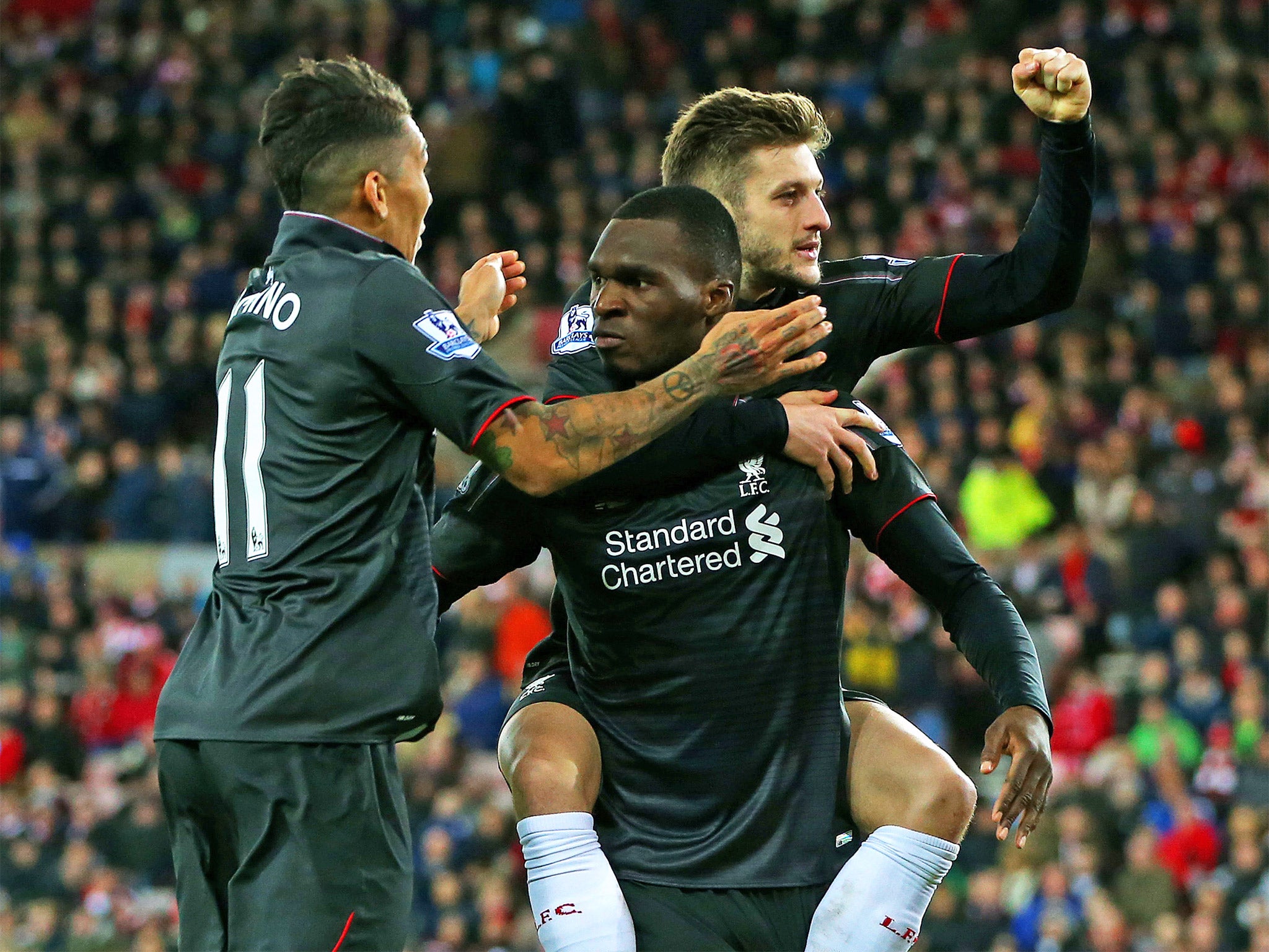Christian Benteke is congratulated by teammates after scoring the winner
