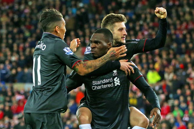 Christian Benteke is congratulated by teammates after scoring the winner