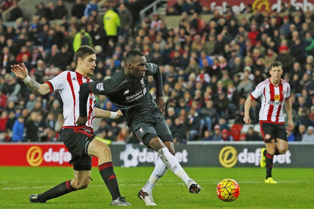 Christian Benteke cooly slots in to give Liverpool the lead