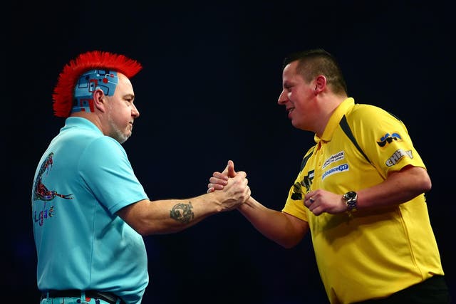 Peter Wright and Dave Chisnall congratulate each other on a thriller at Alexandra Palace