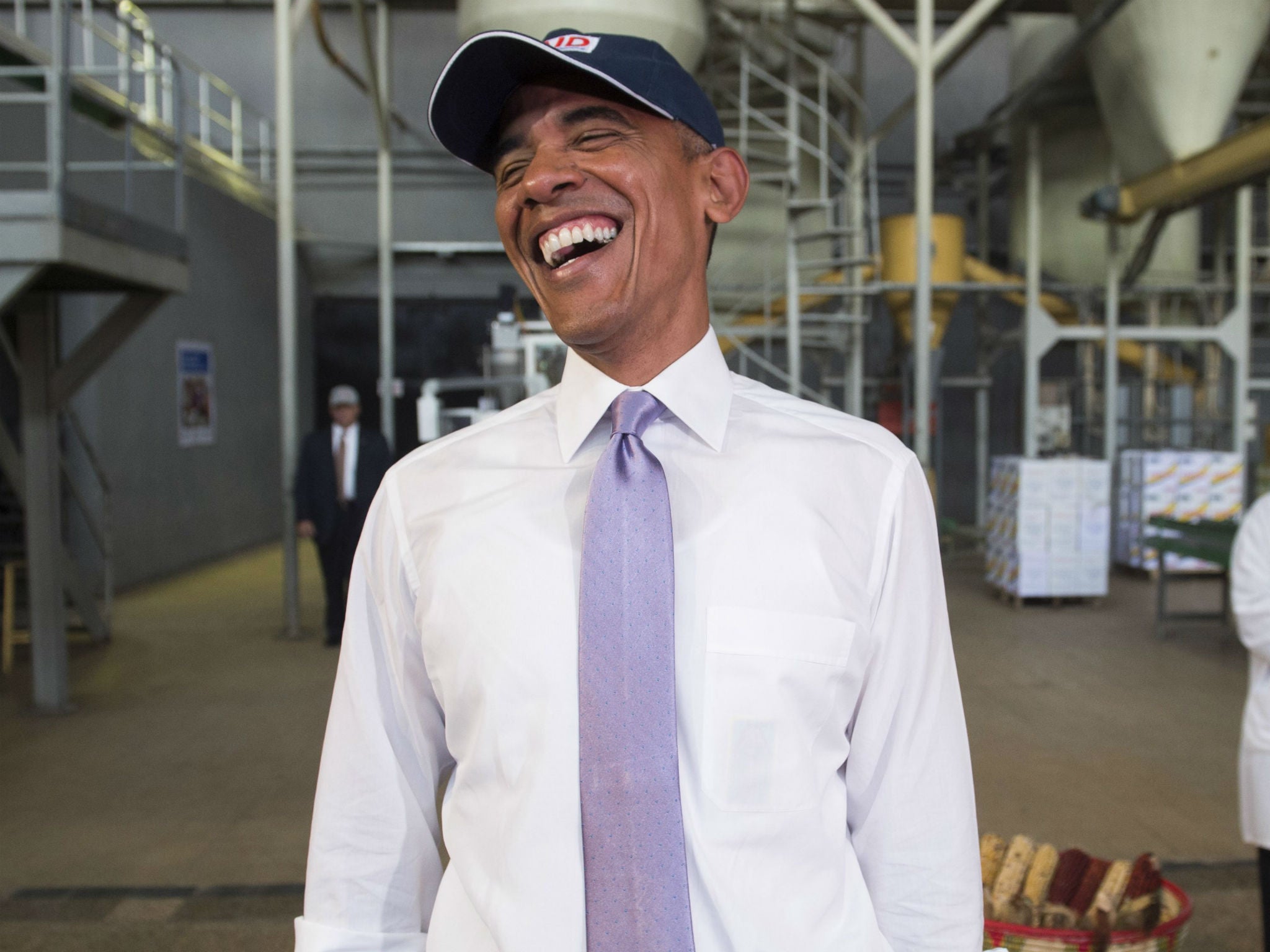 Obama laughed at hair nets members of the press had to wear during a tour of a factory in Ethiopia