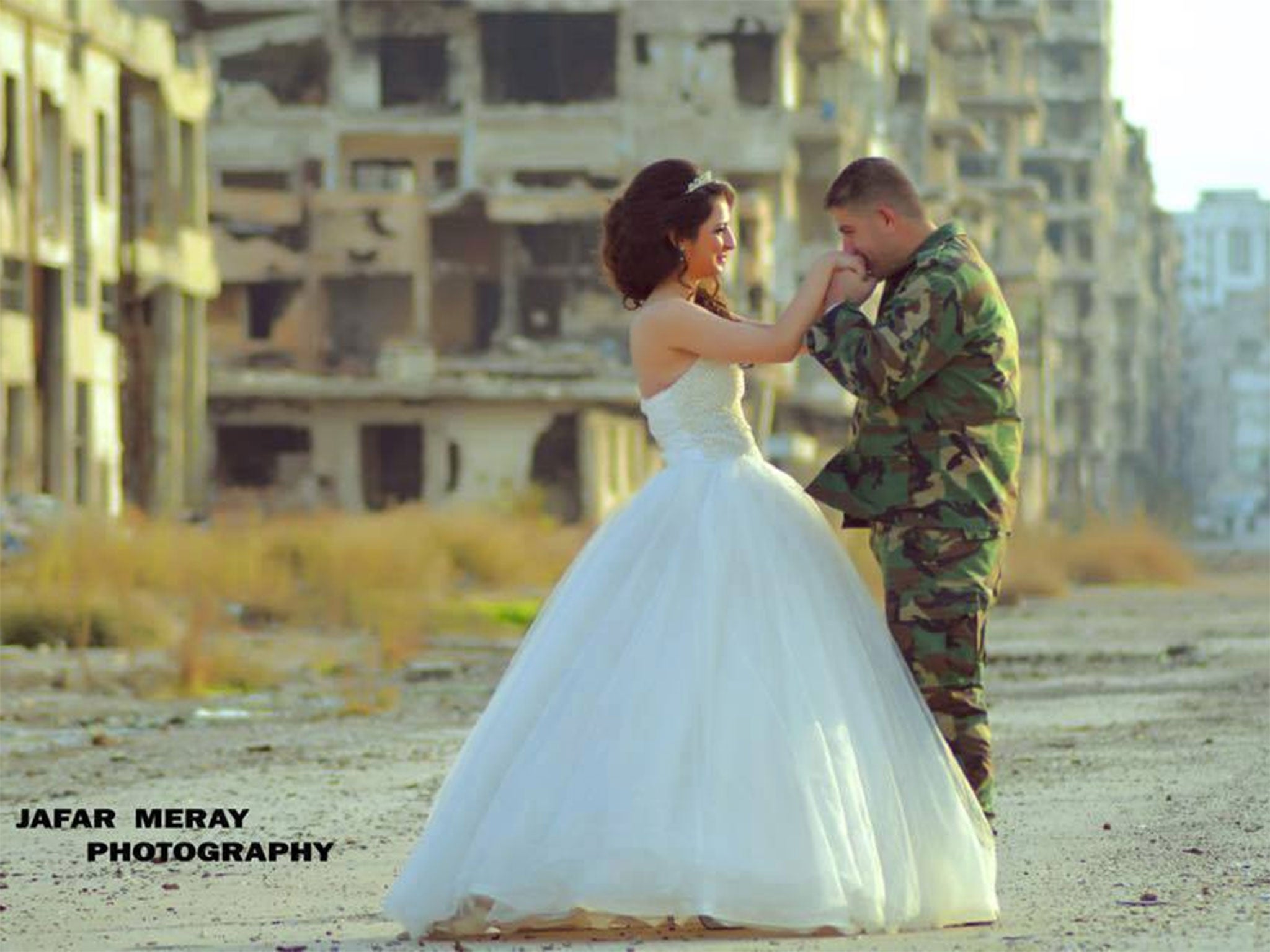 A couple chose to have their wedding photos taken among the ruined buildings of war-torn Homs