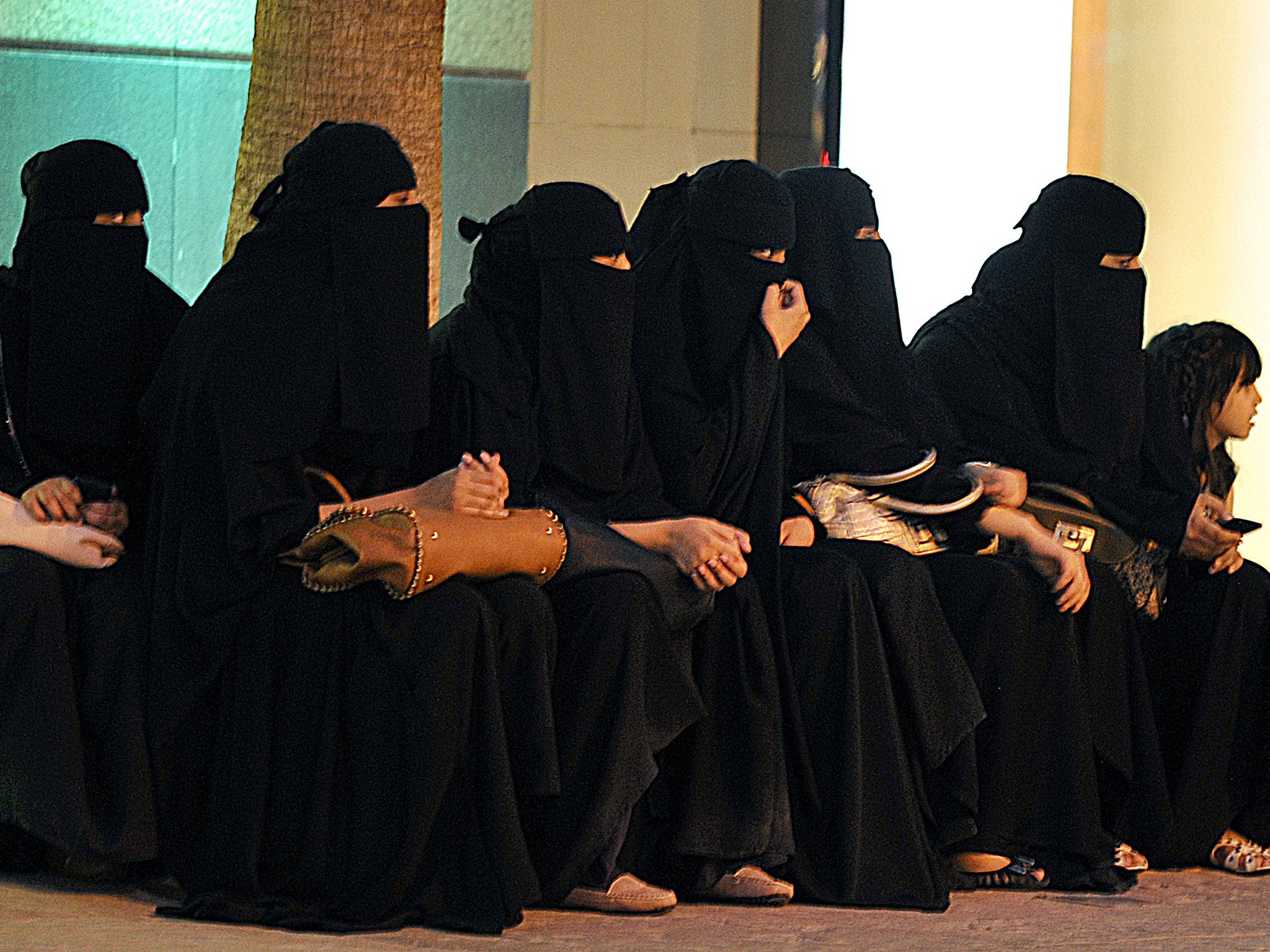 Saudi women waiting for their drivers outside a shopping mall in Riyadh