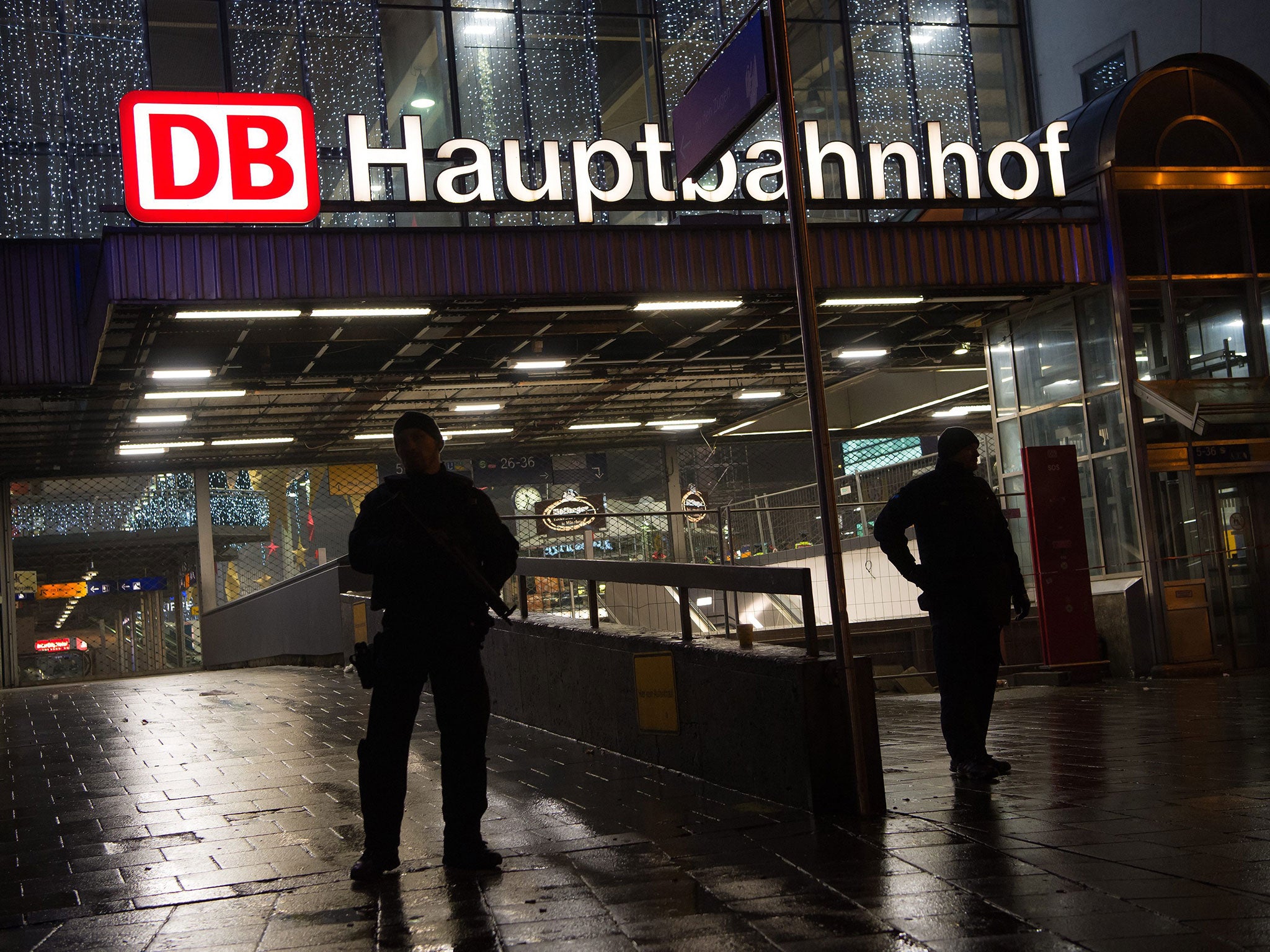 German police on duty at the main railway station in central Munich. Police evacuated Munich's main train station and a second station in the city's Pasing district in response to a credible terrorist threat to the Bavarian capital