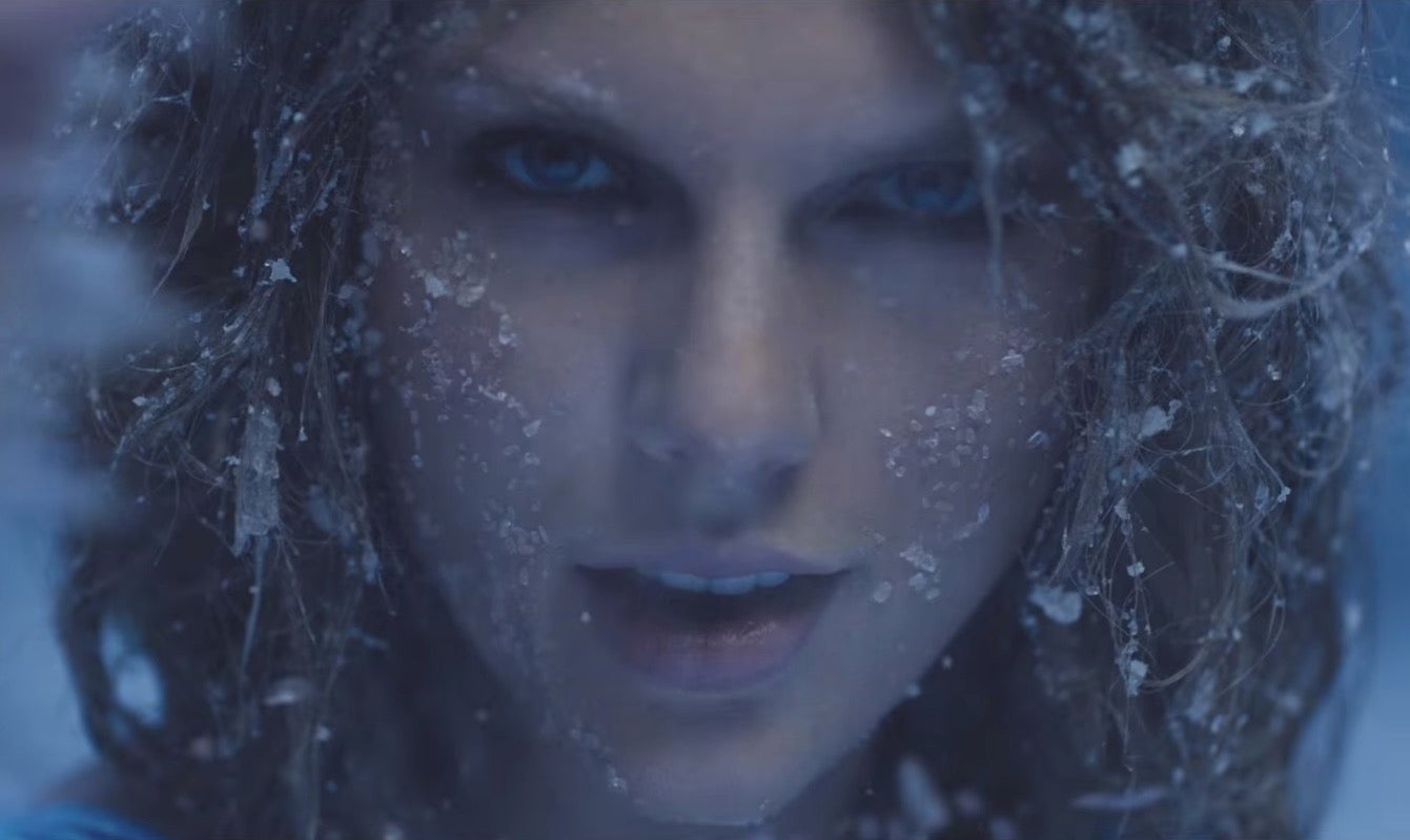 Taylor Swift gets covered in snow in her 'Out of the Woods' music video