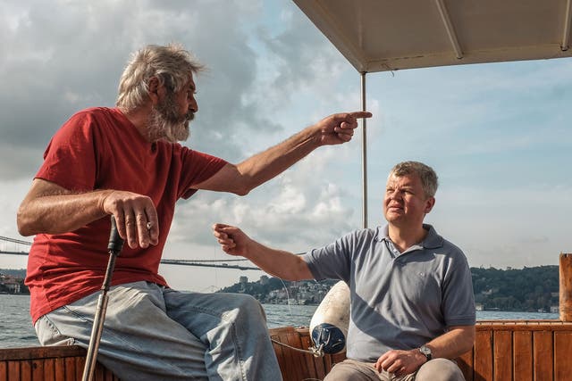 Adrian Chiles taking with a fisherman on the Bosphorus, just outside of Istanbul, in his upcoming BBC documentary My Mediterranean with Adrian Chiles