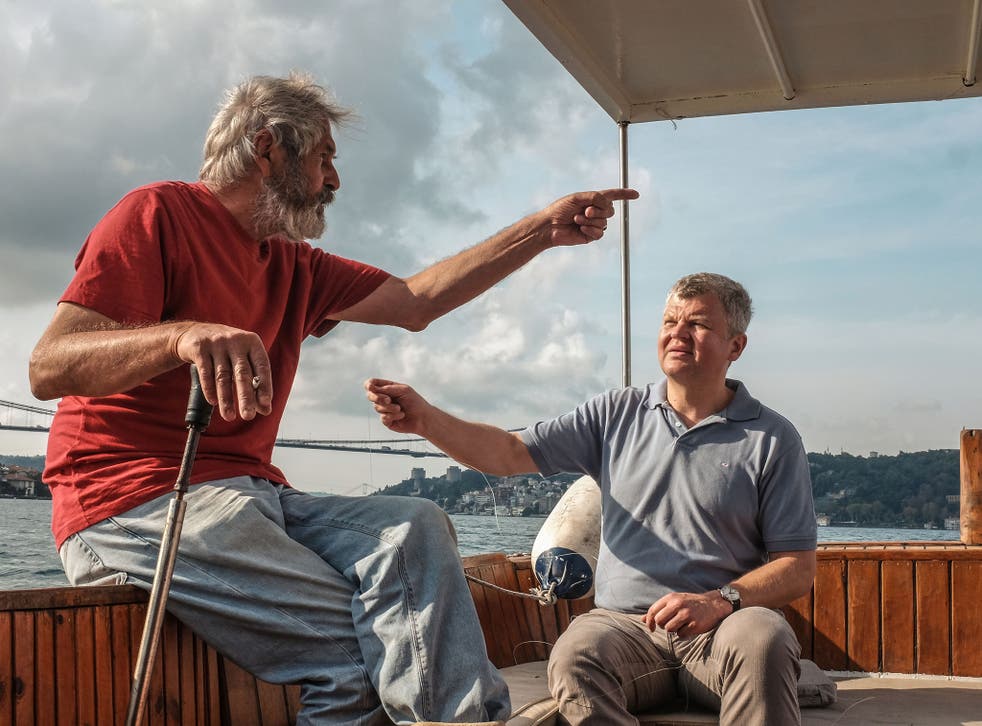 Adrian Chiles taking with a fisherman on the Bosphorus, just outside of Istanbul, in his upcoming BBC documentary My Mediterranean with Adrian Chiles