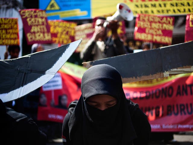 Protestors demonstrate against the execution of an Indonesian maid in Saudi Arabia, on 24 June, 2011 in Yogyakarta, Indonesia