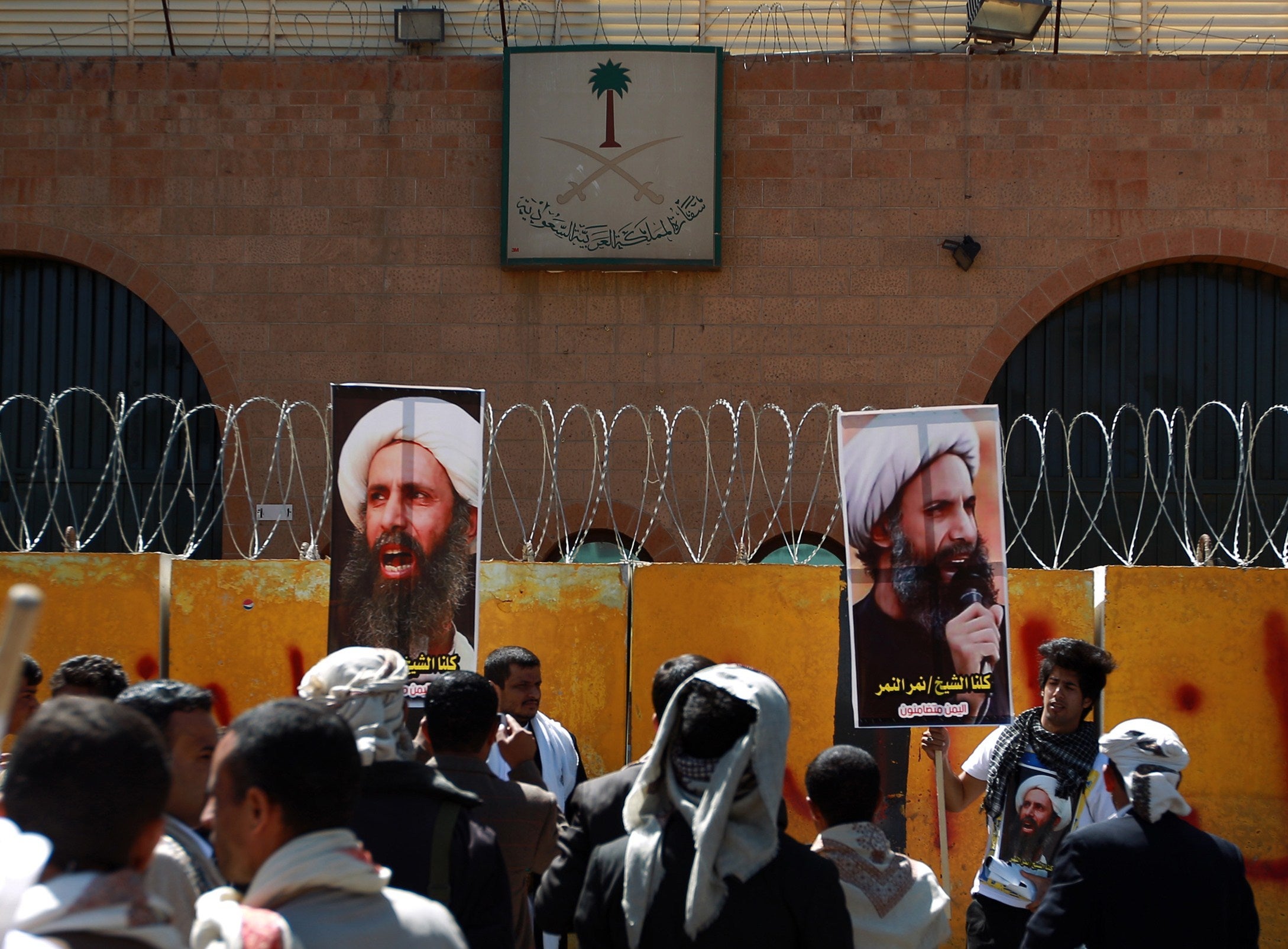 Yemeni protesters demonstrate outside the Saudi embassy in Sanaa against the death sentence of cleric leader Sheikh Nimr al-Nimr