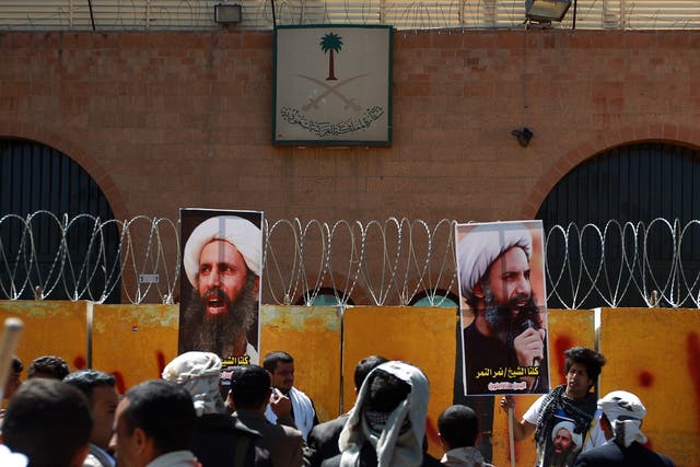 Yemeni protesters demonstrate outside the Saudi embassy in Sanaa against the death sentence of cleric leader Sheikh Nimr al-Nimr