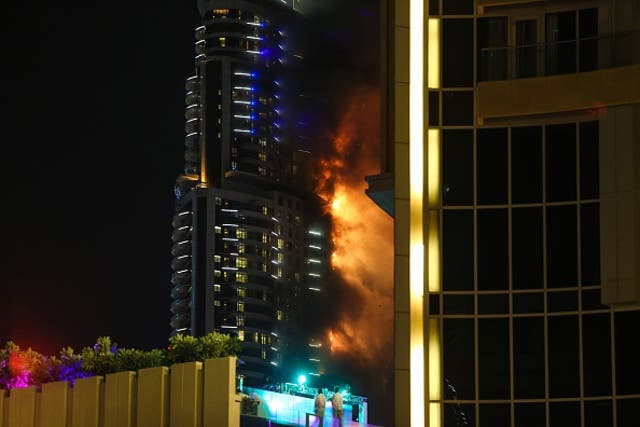 Smoke and flames pour from 63-story skyscraper, Dubai. Photo by Ayman Yaqoob/Anadolu Agency/Getty Images