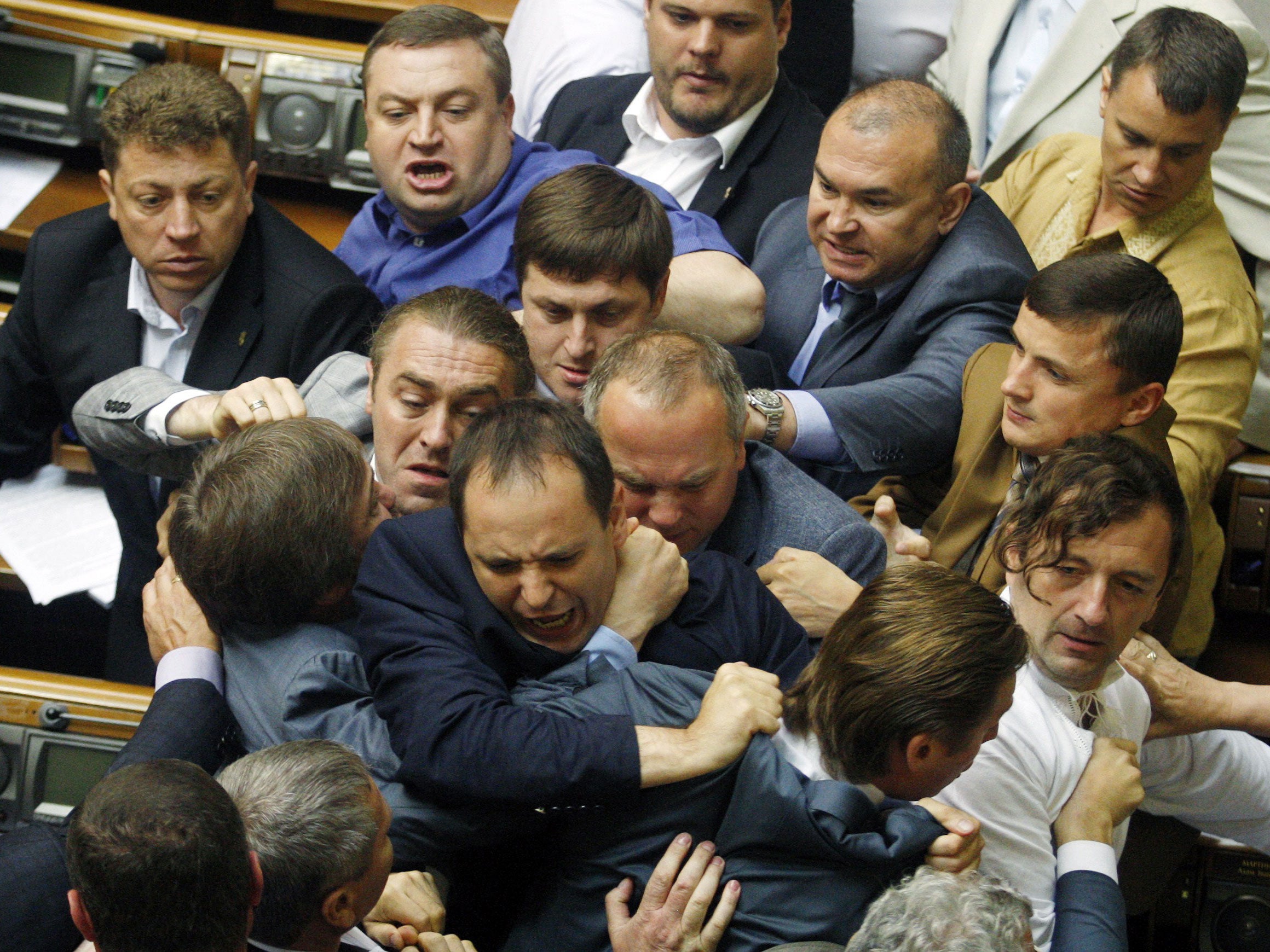 Deputies of the majority fight with the deputies of Regions Party during the debates in the parliament in Kiev