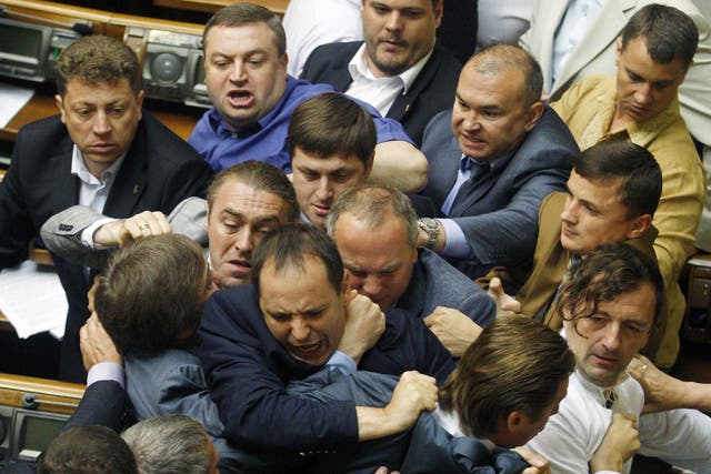 Deputies of the majority fight with the deputies of Regions Party during the debates in the parliament in Kiev