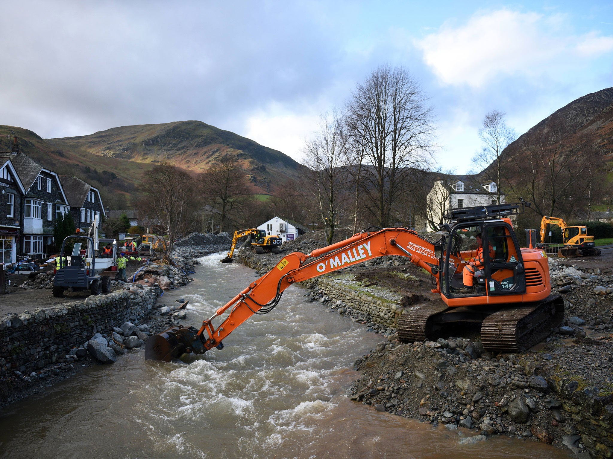 A digger is used to improve drainage in Glenridding in the Lake District