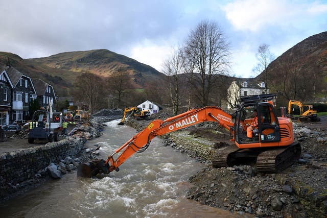 A digger is used to improve drainage in Glenridding in the Lake District