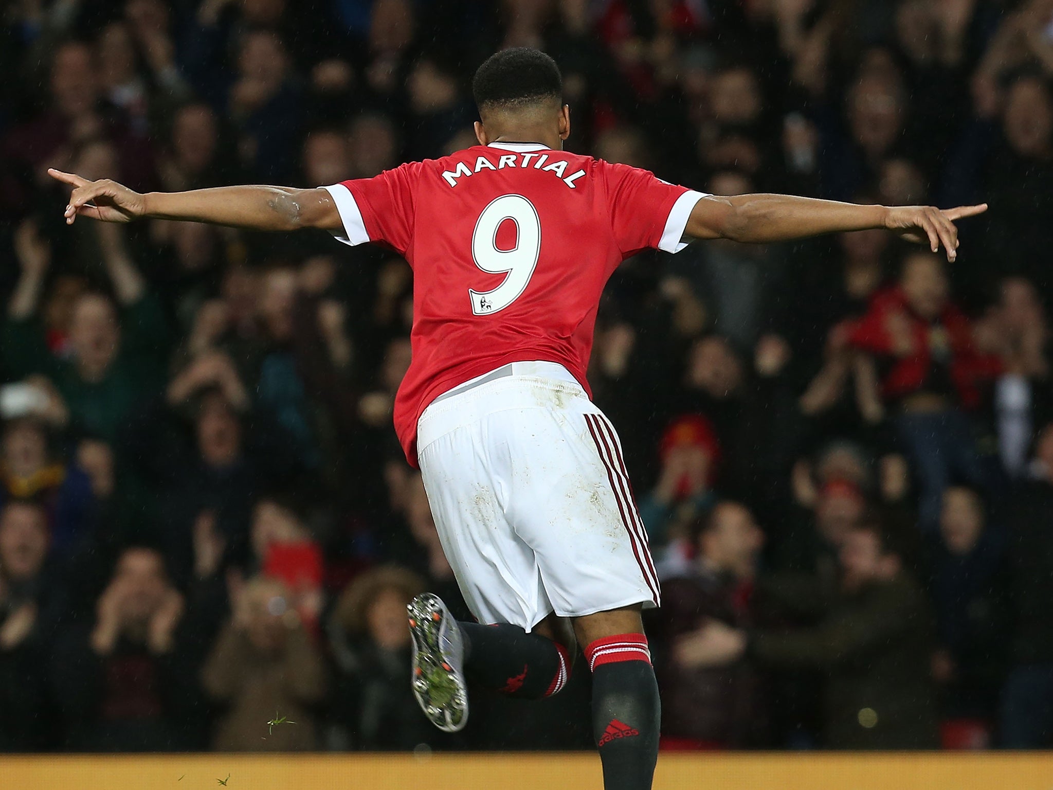 Anthony Martial wheels away after scoring against Swansea City