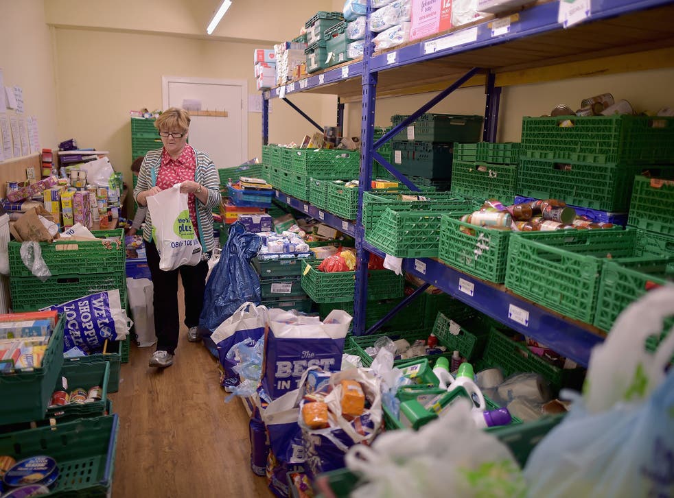 Volunteer Sandra Black packs food at the Trussell Trust Constitution Street food bank