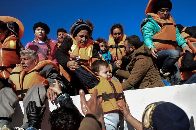 Refugees being rescued on the Greek island of Lesbos in photo dated 26 November 2015