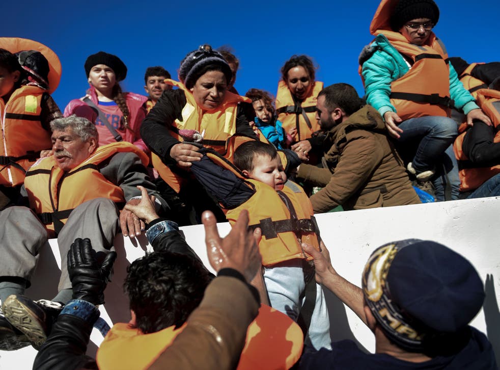 Refugees being rescued on the Greek island of Lesbos in photo dated 26 November 2015