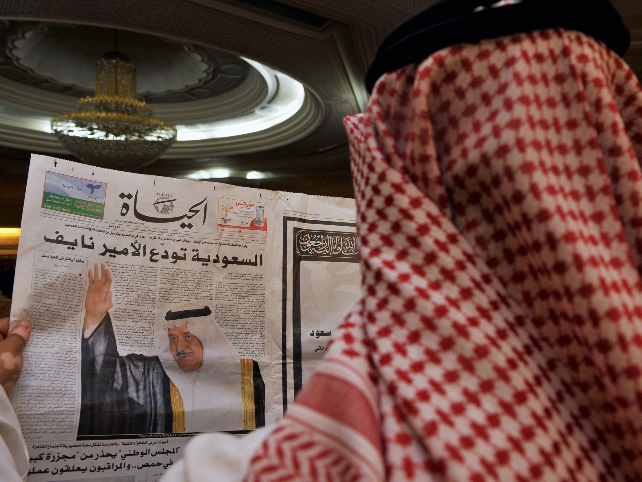 File: A man in Jeddah reads a local newspaper in June 2012