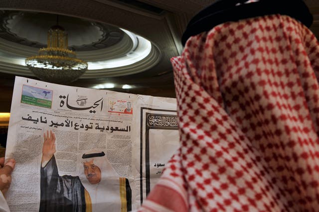 File: A man in Jeddah reads a local newspaper in June 2012