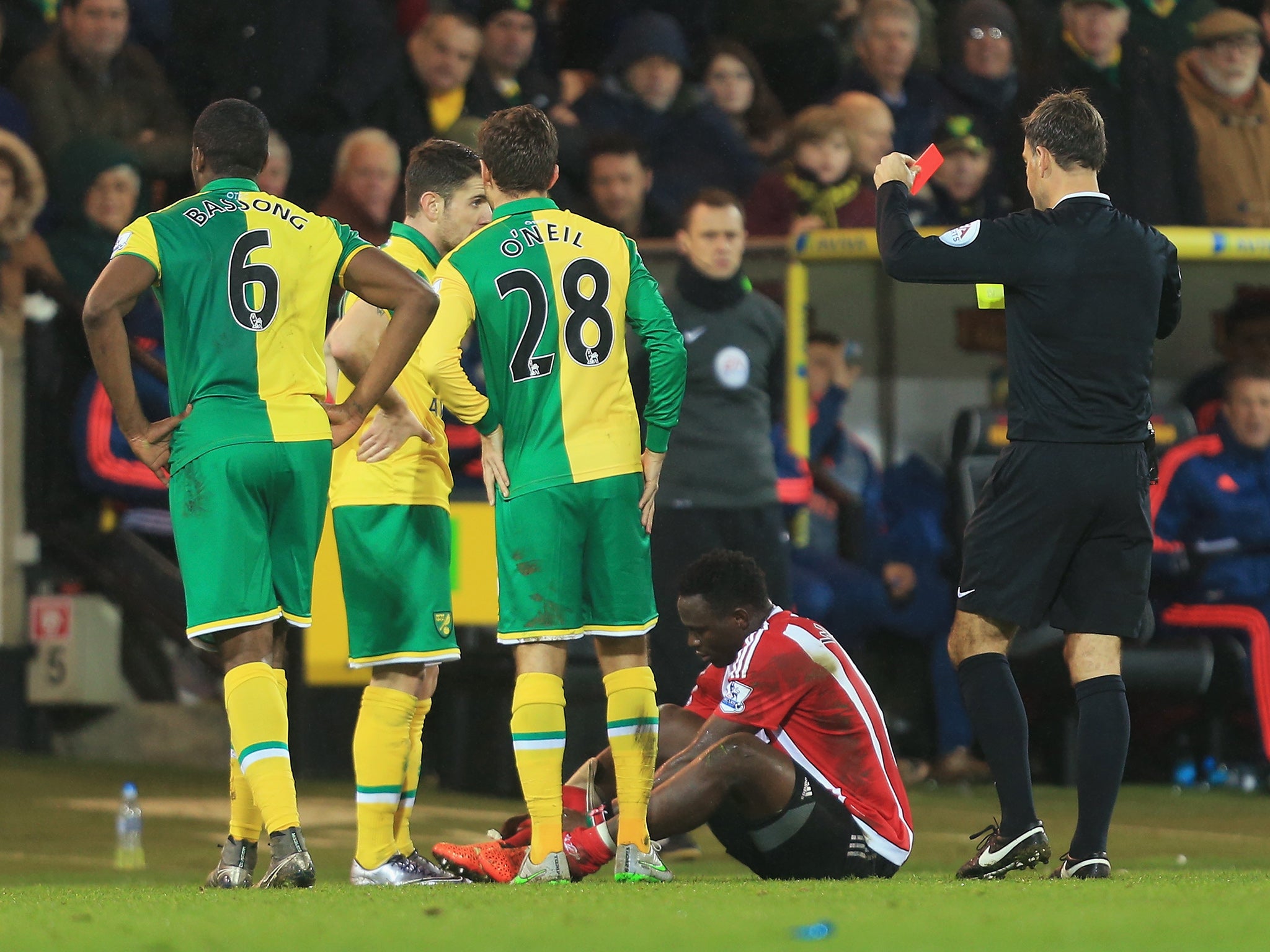 Southampton's Victor Wanyama is shown a red card by referee Mark Clattenburg