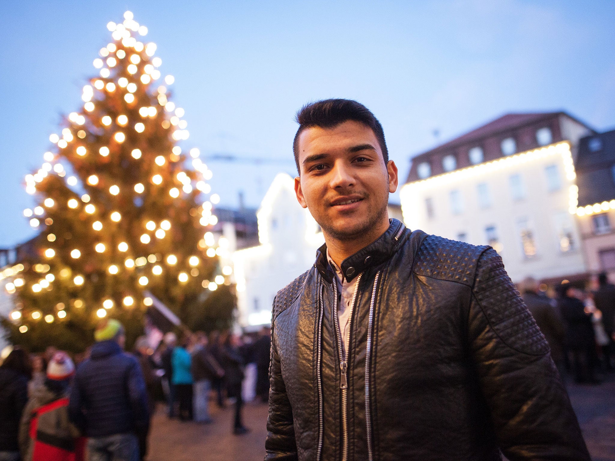 Twenty-year-old Afghan Ramin Amiri joins hundreds of residents who gathered to hear Mayor Richard Arnold speak up for tolerance following the arson attack