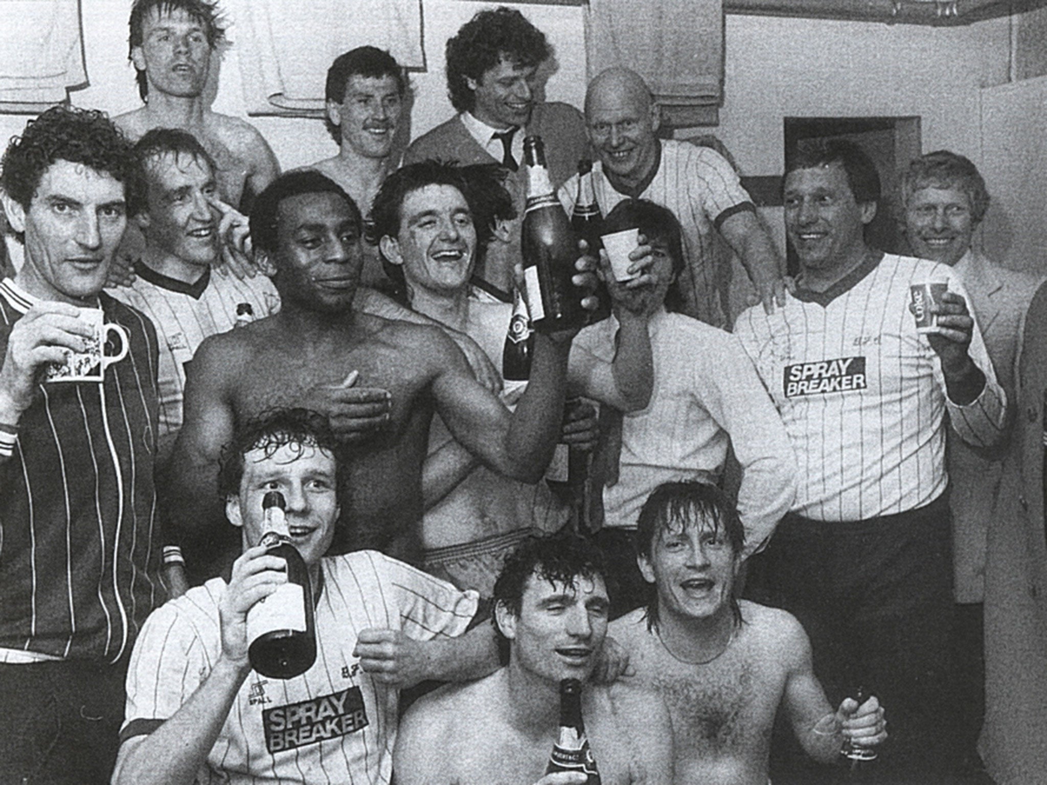 Martin Dobson (left) and his Bury players toast their promotion in the 1984-85 season