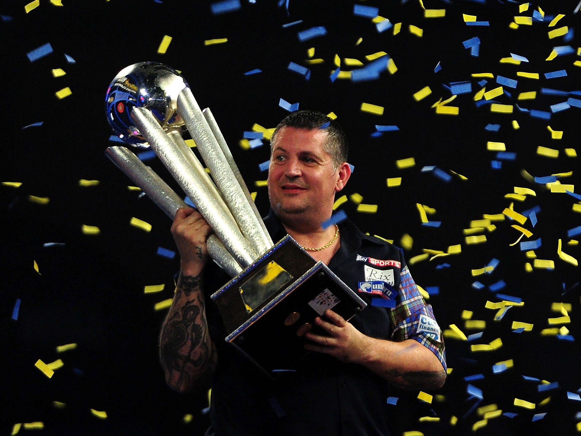Gary Anderson holds the Sid Waddell Trophy after his victory