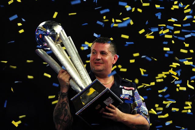 Gary Anderson holds the Sid Waddell Trophy after his victory