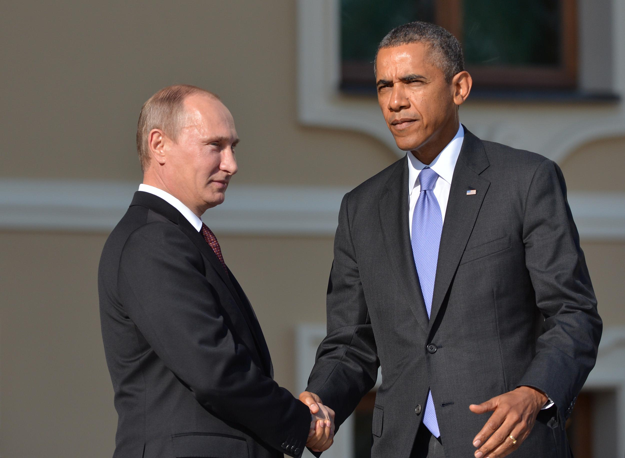 Vladimir Putin and Barack Obama shake hands at the 2013 G20 summit in St Petersburg, Russia