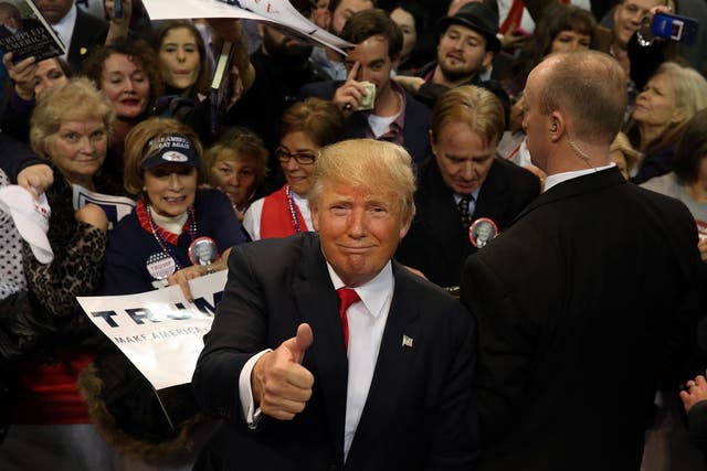 Donald Trump mingles with supporters at a rally in Biloxi, Mississippi on 2 January