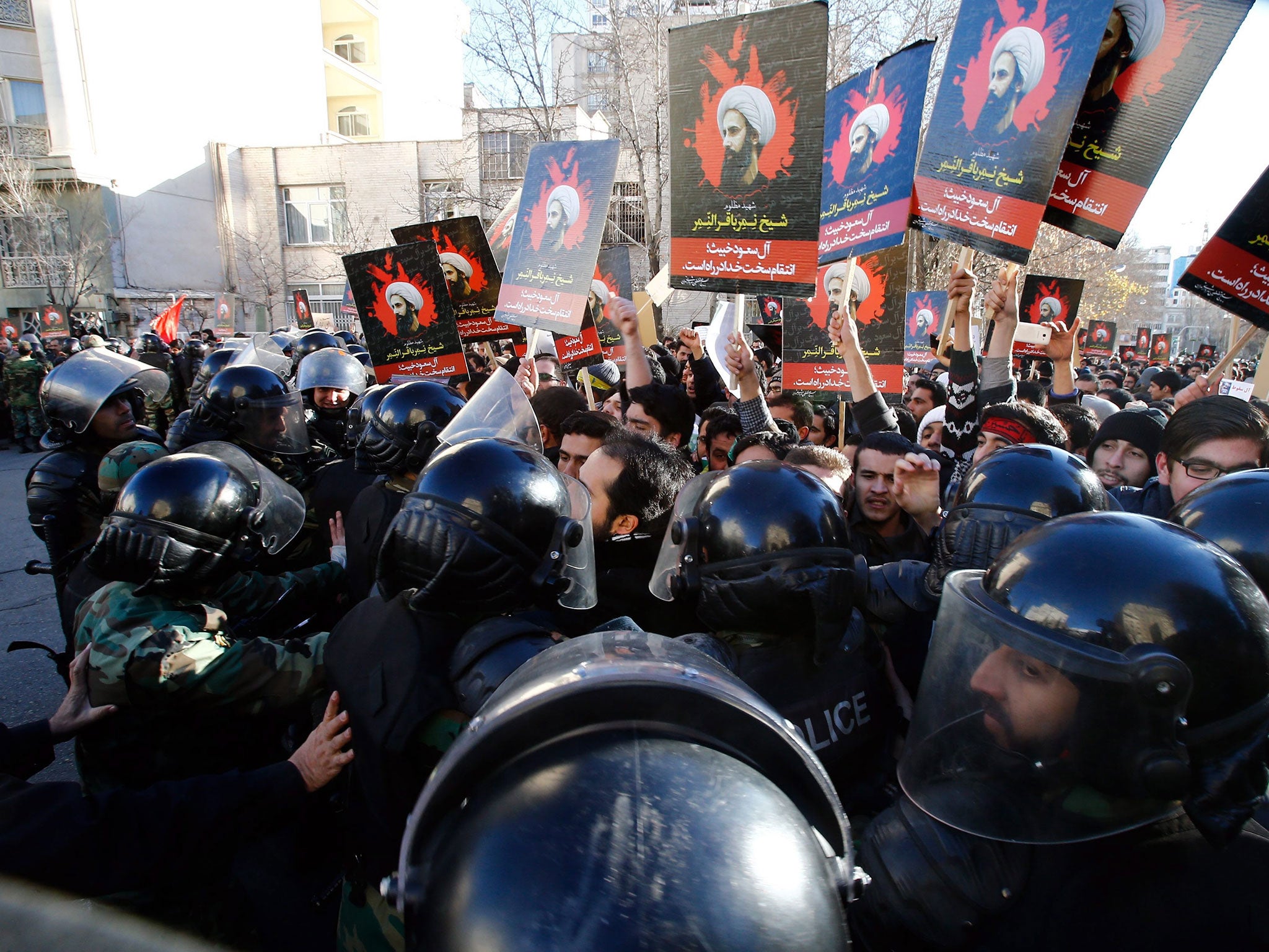 Iranian riot police and demonstrators near the Saudi Arabian embassy in Tehran, Iran, 03 January 2016