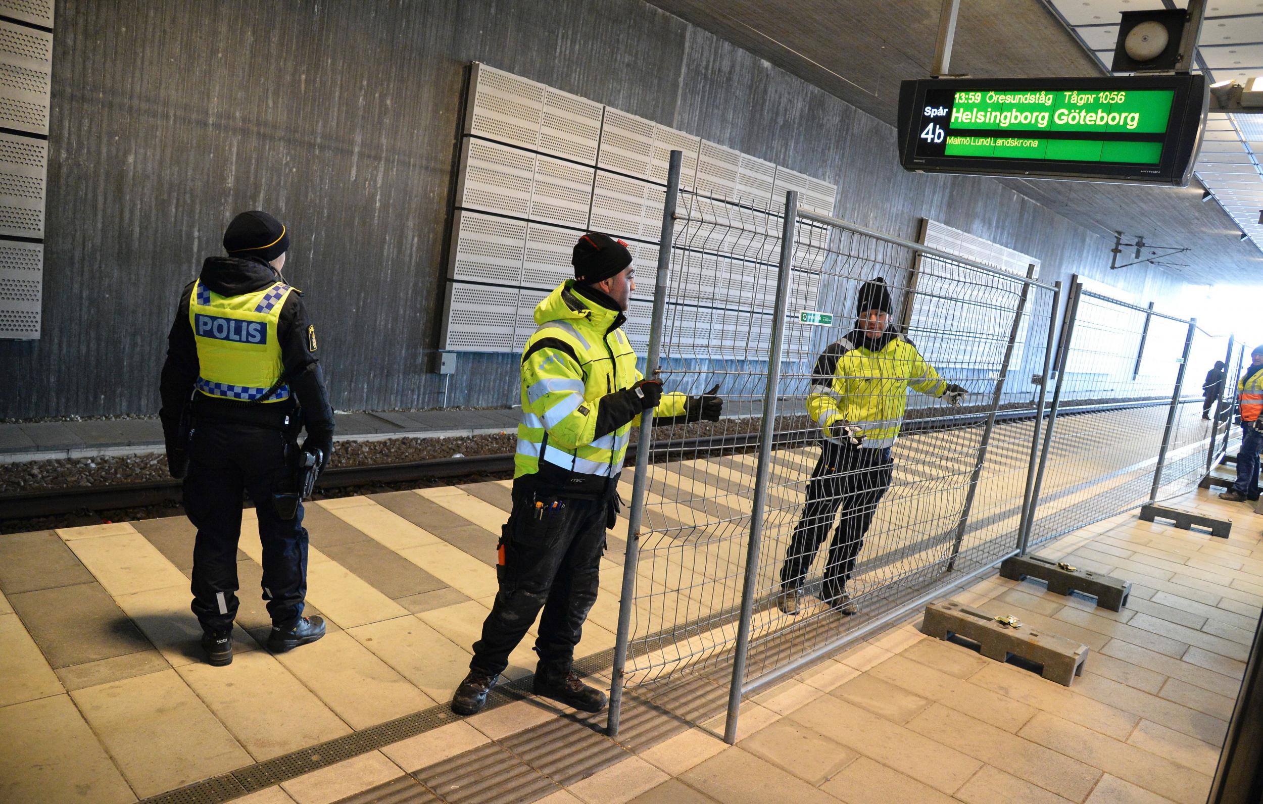 A temporary fence is erected between domestic and international tracks at a train station in Sweden
