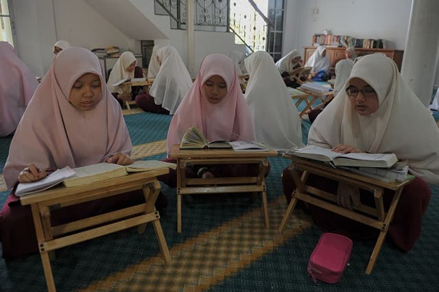 Malaysian religious students learn and memorise the Qur'an at an Islamic school in Hulu Langat on the outskirts of Kuala Lumpur