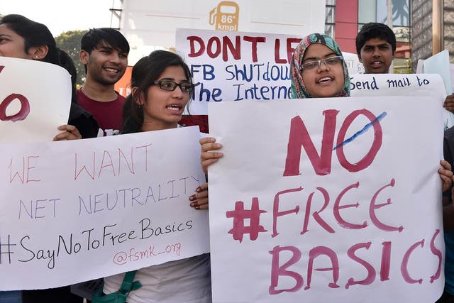 Demonstrators from the Free Software Movement hold placards during a protest against Facebook's Free Basics initiative in Bangalore, India