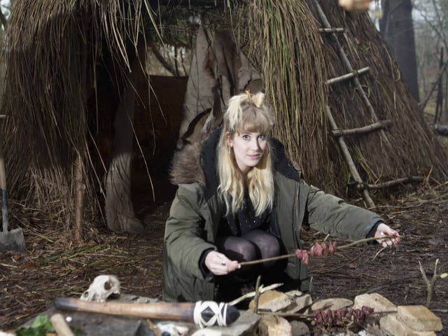 Bright spark: Chloe Hamilton cooks chunks of venison in the camp